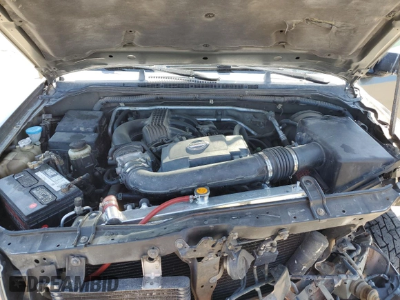 2005 Nissan Frontier LE z VIN 1N6AD07W95C417736, wystawiony jako Copart lot #55112835 z przebiegiem 217 251 mil mil oraz Szkoda całkowita • Salvage title. Historia ofert i sprzedaży dostępna na DreamBid. Obrazek 11.