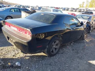 2013 Dodge Challenger Rallye Redline with VIN 2C3CDYAG0DH645961, listed as a IAAI auction lot 41210043 with 205,541 mi miles. Bid and sale history available at carsss.com. Image 4.