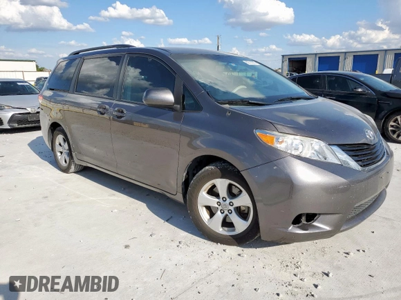 2014 Toyota Sienna LE AAS with VIN 5TDKK3DC8ES445454, listed as a Copart auction lot 62014095 with 143,601 mi miles and Salvage title. Bid and sale history available at DreamBid. Image 4.
