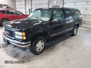 1999 GMC Suburban z VIN 3GKFK16R3XG529761, wystawiony jako IAAI lot #42272646 z przebiegiem 269 114 mil mil oraz . Historia ofert i sprzedaży dostępna na DreamBid. Obrazek 2.