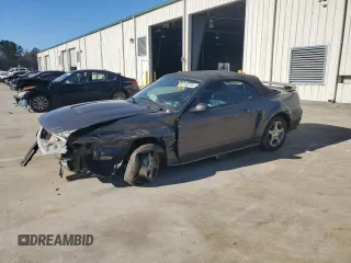2003 Ford Mustang Deluxe with VIN 1FAFP44413F310644, listed as a Copart auction lot 87742715 with 136,922 mi miles and Salvage Title. Bid and sale history available at carsss.com. Image 1.