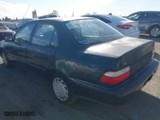 1997 Toyota Corolla with VIN 1NXBA02E5VZ595972, listed as a IAAI auction lot 41622050 with 143,577 mi miles. Bid and sale history available at carsss.com. Image 3.