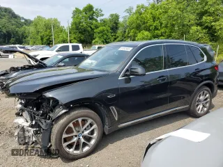 2023 BMW X5 xDrive45e z VIN 5UXTA6C09P9R00571, wystawiony jako Copart lot #61052995 z przebiegiem 9 702 mil mil oraz Szkoda całkowita • Salvage title. Historia ofert i sprzedaży dostępna na DreamBid. Obrazek 1.