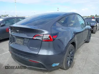 2021 Tesla Model Y Long Range with VIN 5YJYGDEE6MF209034, listed as a IAAI auction lot 41896238 with 53,401 mi miles. Bid and sale history available at carsss.com. Image 4.