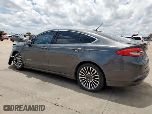 2017 Ford Fusion Hybrid Titanium with VIN 3FA6P0RU1HR368930, listed as a Copart auction lot 64965075 with 180,607 mi miles and Clean title. Bid and sale history available at DreamBid. Image 2.