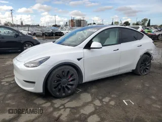2021 Tesla Model Y Performance with VIN 5YJYGDEF4MF201815, listed as a Copart auction lot 42453075 with 76,888 mi miles and Salvage Title. Bid and sale history available at DreamBid. Image 1.