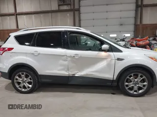 2016 Ford Escape Titanium with VIN 1FMCU9J95GUB02377, listed as a IAAI auction lot 41869557 with 88,441 mi miles. Bid and sale history available at carsss.com. Image 6.