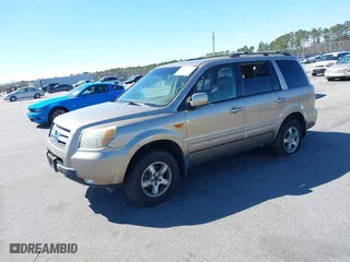 2006 Honda Pilot EX-L with VIN 5FNYF18516B020162, listed as a IAAI auction lot 41799229 with 304,627 mi miles. Bid and sale history available at carsss.com. Image 2.