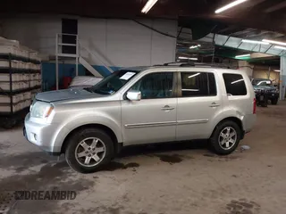 2009 Honda Pilot Touring with VIN 5FNYF48929B010331, listed as a IAAI auction lot 41965094 with 142,490 mi miles and . Bid and sale history available at carsss.com. Image 14.