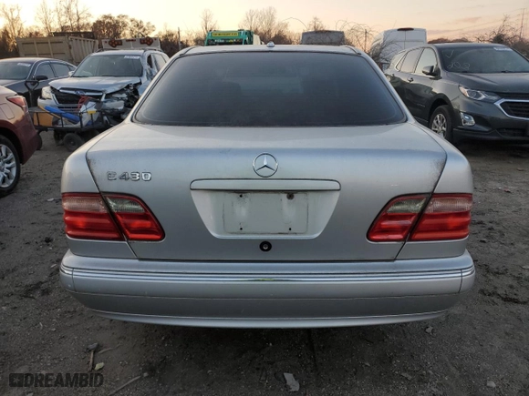 2000 Mercedes-Benz E-Class with VIN WDBJF70J7YB049473, listed as a Copart auction lot 82396624 with 197,515 mi miles and Salvage Title. Bid and sale history available at carsss.com. Image 6.