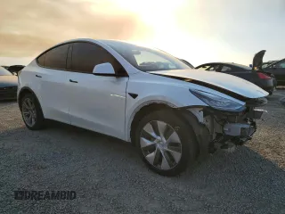2023 Tesla Model Y Long Range with VIN 7SAYGDEE9PA129876, listed as a Copart auction lot 41819605 with 36,110 mi miles and Salvage Title. Bid and sale history available at DreamBid. Image 4.