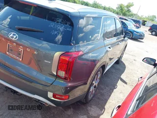 2021 Hyundai Palisade SEL z VIN KM8R4DHE2MU184984, wystawiony jako IAAI lot #42221108 z przebiegiem 107 960 mil mil oraz . Historia ofert i sprzedaży dostępna na DreamBid. Obrazek 4.