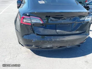 2019 Tesla Model 3 Mid Range with VIN 5YJ3E1EA5KF306816, listed as a IAAI auction lot 41710916 with 76,222 mi miles. Bid and sale history available at carsss.com. Image 6.