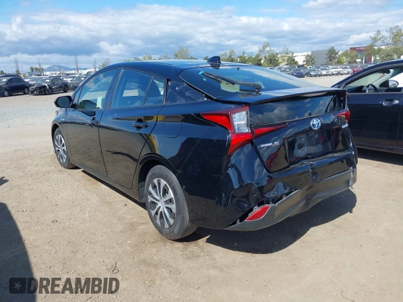 2021 Toyota Prius L Eco with VIN JTDKAMFU6M3135799, listed as a IAAI auction lot 42064241 with 77,120 mi miles and . Bid and sale history available at DreamBid. Image 3.