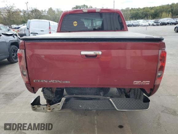 2010 GMC Canyon SLE1 with VIN 1GTJTCDP1A8136659, listed as a Copart auction lot 74568354 with 243,634 mi miles and Salvage Title. Bid and sale history available at carsss.com. Image 6.