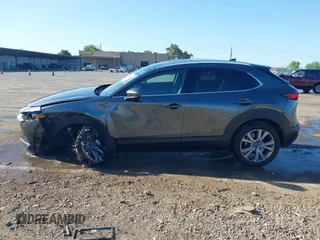 2022 Mazda CX-30 S Premium with VIN 3MVDMBDL0NM413867, listed as a IAAI auction lot 42082560 with 12,375 mi miles and . Bid and sale history available at DreamBid. Image 14.