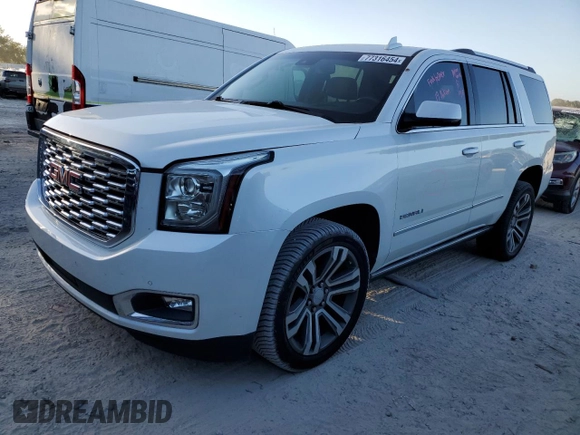 2019 GMC Yukon Denali with VIN 1GKS1CKJ8KR353280, listed as a Copart auction lot 77316454 with 74,476 mi miles and Salvage Title. Bid and sale history available at carsss.com. Image 1.