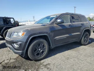 2014 Jeep Grand Cherokee Laredo with VIN 1C4RJEAG7EC212915, listed as a Copart auction lot 70144534 with 169,851 mi miles and Clean Title. Bid and sale history available at carsss.com. Image 1.