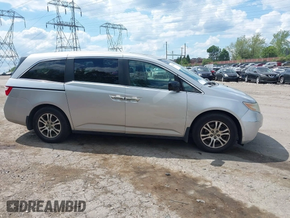 2012 Honda Odyssey EX-L with VIN 5FNRL5H67CB139701, listed as a IAAI auction lot 42233283 with 147,143 mi miles and . Bid and sale history available at DreamBid. Image 14.