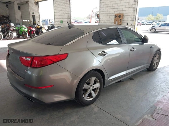 2015 Kia Optima LX with VIN 5XXGM4A77FG415572, listed as a IAAI auction lot 41611627 with 157,836 mi miles. Bid and sale history available at carsss.com. Image 4.