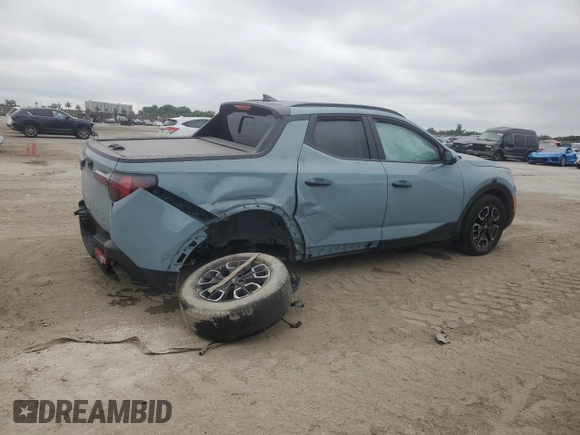 2023 Hyundai Santa Cruz SEL z VIN 5NTJC4AE4PH043025, wystawiony jako Copart lot #41617645 z przebiegiem Nie podano mil oraz Nie do naprawy • Non repairable. Historia ofert i sprzedaży dostępna na DreamBid. Obrazek 3.