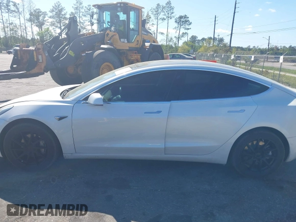2019 Tesla Model 3 Mid Range with VIN 5YJ3E1EA7KF425127, listed as a IAAI auction lot 41886436 with 87,236 mi miles and . Bid and sale history available at carsss.com. Image 14.