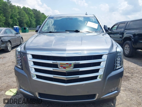 2020 Cadillac Escalade Luxury z VIN 1GYS3BKJ0LR116410, wystawiony jako IAAI lot #42274841 z przebiegiem 75 513 mil mil oraz . Historia ofert i sprzedaży dostępna na DreamBid. Obrazek 12.