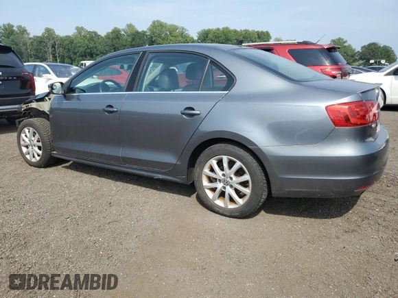 2014 Volkswagen Jetta SE z VIN 3VWD17AJ8EM405443, wystawiony jako Copart lot #59843445 z przebiegiem 156 331 mil mil oraz Szkoda całkowita • Salvage title. Historia ofert i sprzedaży dostępna na DreamBid. Obrazek 2.