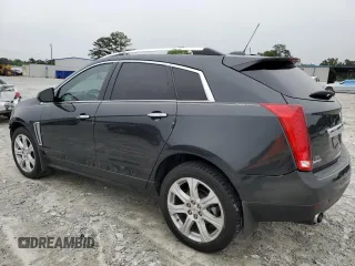 2015 Cadillac SRX Performance Collection with VIN 3GYFNCE38FS597717, listed as a Copart auction lot 57629615 with 102,689 mi miles and Salvage title. Bid and sale history available at DreamBid. Image 2.
