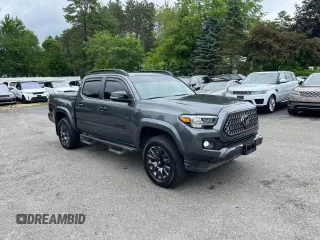 2022 Toyota Tacoma Limited with VIN 3TMGZ5AN7NM458988, listed as a Copart auction lot 65398105 with 32,115 mi miles and Salvage title. Bid and sale history available at DreamBid. Image 1.