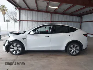 2023 Tesla Model Y Long Range z VIN 7SAYGDEE2PF834036, wystawiony jako IAAI lot #41933120 z przebiegiem 27 872 mil mil oraz . Historia ofert i sprzedaży dostępna na DreamBid. Obrazek 15.