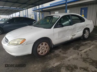 2003 Ford Taurus LX Standard z VIN 1FAFP52U53G280700, wystawiony jako Copart lot #87488014 z przebiegiem 128 020 mil mil oraz Szkoda całkowita • Salvage title. Historia ofert i sprzedaży dostępna na DreamBid. Obrazek 1.