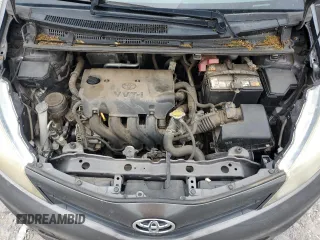 2012 Toyota Yaris L z VIN JTDJTUD3XCD512501, wystawiony jako Copart lot #56353845 z przebiegiem 148 907 mil mil oraz Czysty tytuł • Clean title. Historia ofert i sprzedaży dostępna na DreamBid. Obrazek 11.