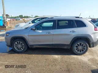 2019 Jeep Cherokee Latitude Plus with VIN 1C4PJLLB5KD403431, listed as a IAAI auction lot 42127918 with 94,360 mi miles and . Bid and sale history available at DreamBid. Image 13.