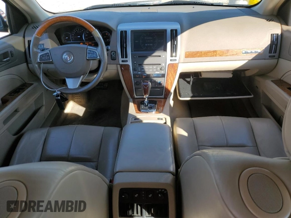 2009 Cadillac STS AWD z VIN 1G6DD67V690120833, wystawiony jako Copart lot #42502345 z przebiegiem 100 250 mil mil oraz Szkoda całkowita • Salvage title. Historia ofert i sprzedaży dostępna na DreamBid. Obrazek 8.