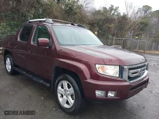 2009 Honda Ridgeline RTL with VIN 5FPYK16559B103698, listed as a IAAI auction lot 41479390 with 144,554 mi miles. Bid and sale history available at carsss.com. Image 1.