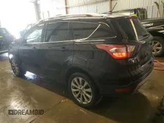 2018 Ford Escape Titanium with VIN 1FMCU9J9XJUA01357, listed as a Copart auction lot 56868735 with 67,315 mi miles and Salvage title. Bid and sale history available at DreamBid. Image 2.