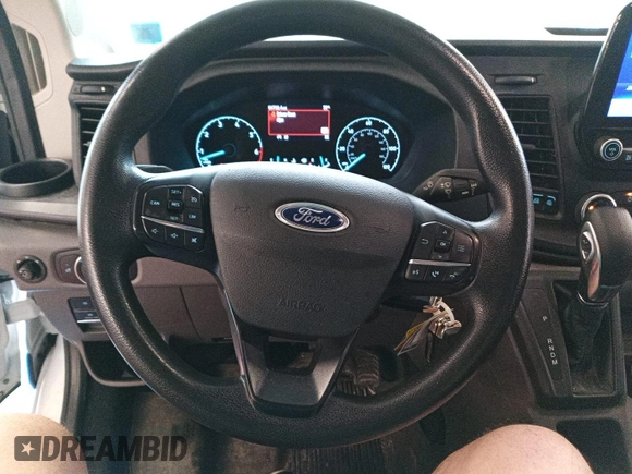 2021 Ford Transit Cargo with VIN 1FTBR2YG2MKA51800, listed as a IAAI auction lot 42793917 with 61,733 mi miles and . Bid and sale history available at DreamBid. Image 27.