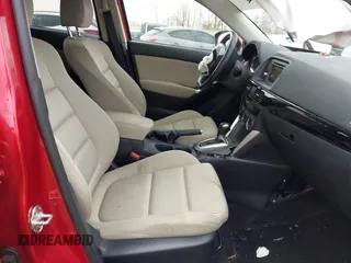 2014 Mazda CX-5 Touring with VIN JM3KE2CY4E0411780, listed as a IAAI auction lot 41903570 with 103,658 mi miles and . Bid and sale history available at DreamBid. Image 5.
