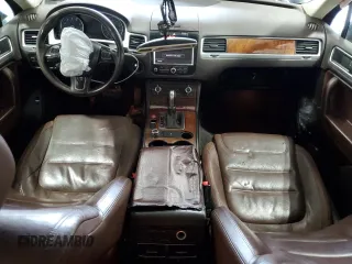 2014 Volkswagen Touareg Sport с VIN WVGEF9BP2ED002718, выставлен на аукционе Copart как лот 59526575 с пробегом 194 480 миль миль и На запчасти • Non repairable. История ставок и продаж доступна на DreamBid. Изображение 8.