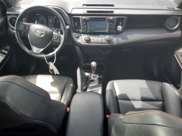 2018 Toyota RAV4 SE with VIN JTMJFREVXJD256779, listed as a Copart auction lot 52521195 with 100,453 mi miles and Salvage Title. Bid and sale history available at carsss.com. Image 8.