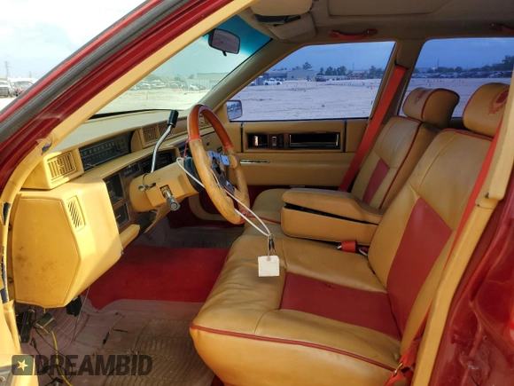1991 Cadillac DeVille z VIN 1G6CD53B2M4335645, wystawiony jako Copart lot #53390805 z przebiegiem 210 451 mil mil oraz Szkoda całkowita • Salvage title. Historia ofert i sprzedaży dostępna na DreamBid. Obrazek 7.