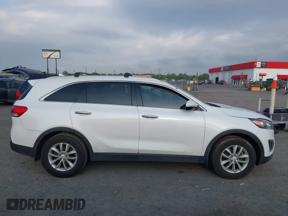 2017 Kia Sorento LX with VIN 5XYPG4A35HG205801, listed as a IAAI auction lot 42143064 with 129,647 mi miles. Bid and sale history available at carsss.com. Image 13.