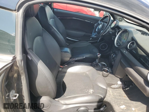 2015 MINI Coupe S z VIN WMWSX3C55FT409449, wystawiony jako Copart lot #66574174 z przebiegiem 99 155 mil mil oraz Szkody całkowita. Historia ofert i sprzedaży dostępna na DreamBid. Obrazek 10.