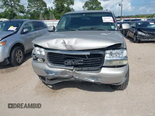 2004 GMC Yukon SLE z VIN 1GKEC13V44R175383, wystawiony jako IAAI lot #42155877 z przebiegiem 303 482 mil mil oraz . Historia ofert i sprzedaży dostępna na DreamBid. Obrazek 6.