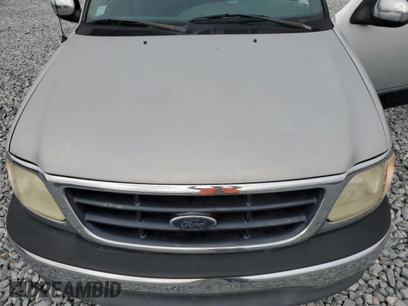 2000 Ford F-150 XL z VIN 2FTRX07L1YCA33404, wystawiony jako Copart lot #51214145 z przebiegiem Nie podano mil oraz Szkoda całkowita • Salvage title. Historia ofert i sprzedaży dostępna na DreamBid. Obrazek 11.