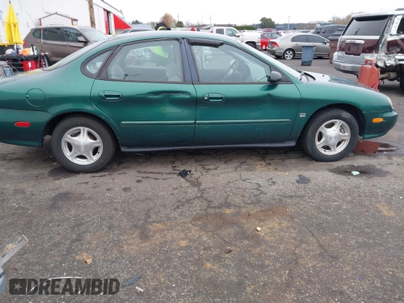 1999 Ford Taurus z VIN 1FAFP52S9XG309250, wystawiony jako IAAI lot #41797222 z przebiegiem 102 676 mil mil oraz . Historia ofert i sprzedaży dostępna na DreamBid. Obrazek 6.