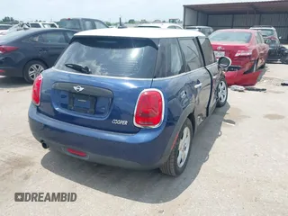 2017 MINI Hardtop 4 Door Cooper with VIN WMWXU1C59H2E18069, listed as a IAAI auction lot 42286035 with 85,835 mi miles and . Bid and sale history available at DreamBid. Image 4.