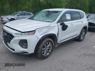 2019 Hyundai Santa Fe SE with VIN 5NMS2CAD9KH117777, listed as a IAAI auction lot 42296811 with 82,188 mi miles and . Bid and sale history available at DreamBid. Image 2.