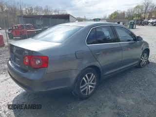2005 Volkswagen Jetta Sedan 2.5L with VIN 3VWSG71K35M617763, listed as a IAAI auction lot 41963065 with 200,915 mi miles. Bid and sale history available at carsss.com. Image 4.